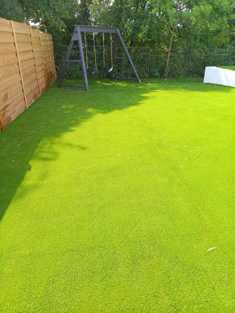 patio artificial grass between pavers