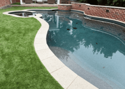 swimming pool with custom stone paver