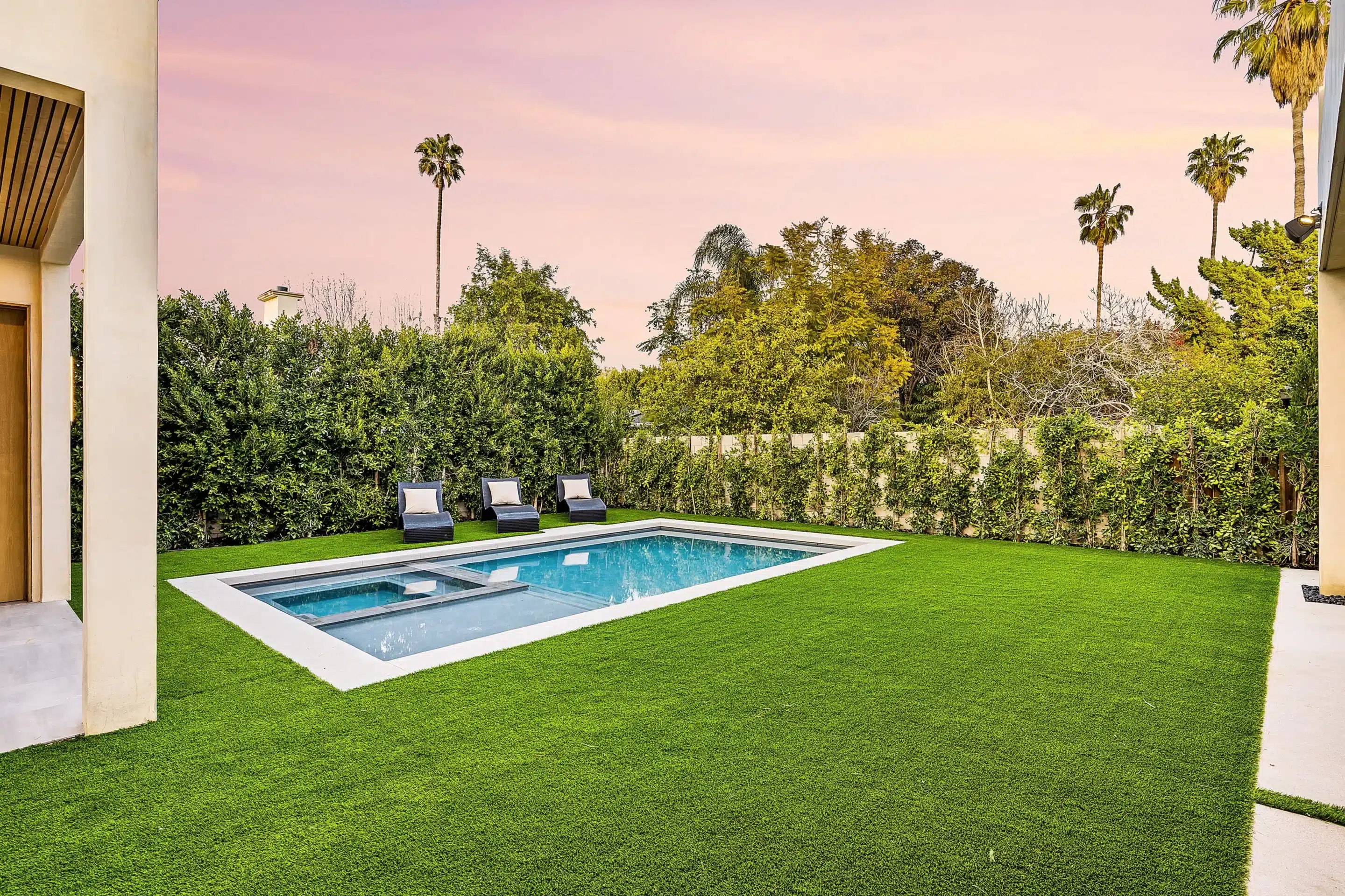 Complete yard turf and hardscape around a pool