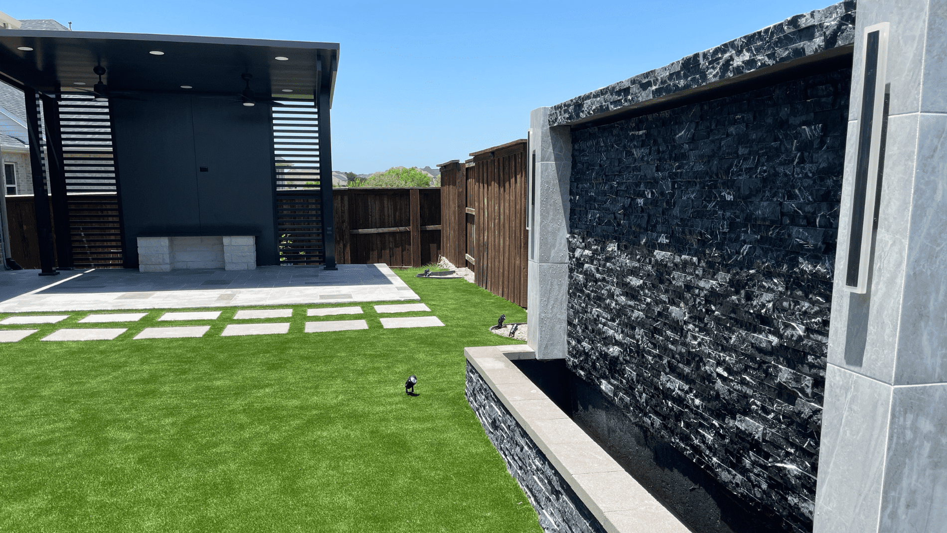 Modern waterfall wall and black gazebo